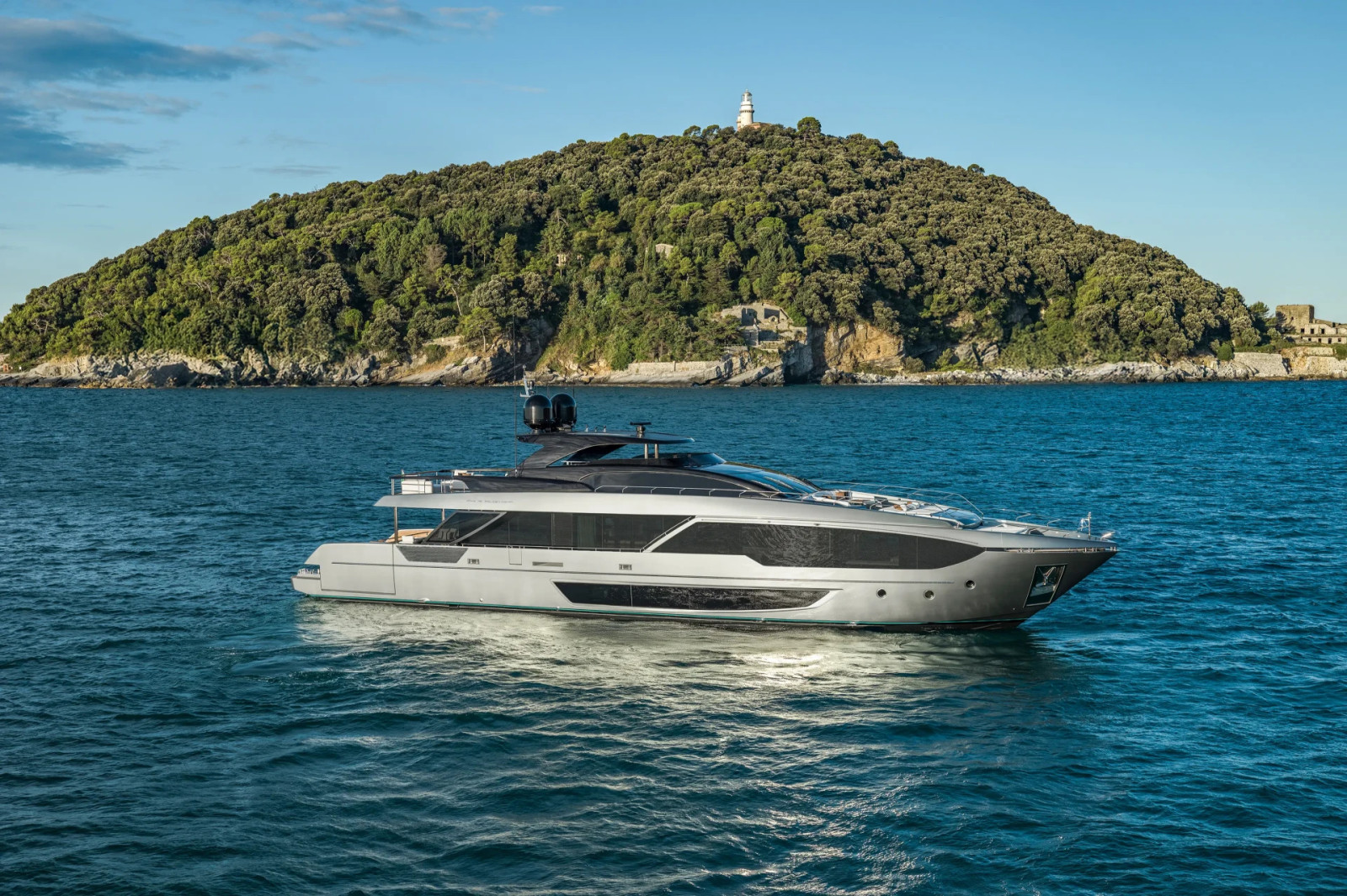 Side profile of the Riva 112' Dolcevita Super, showcasing its contemporary lines, large windows and spacious yacht design.