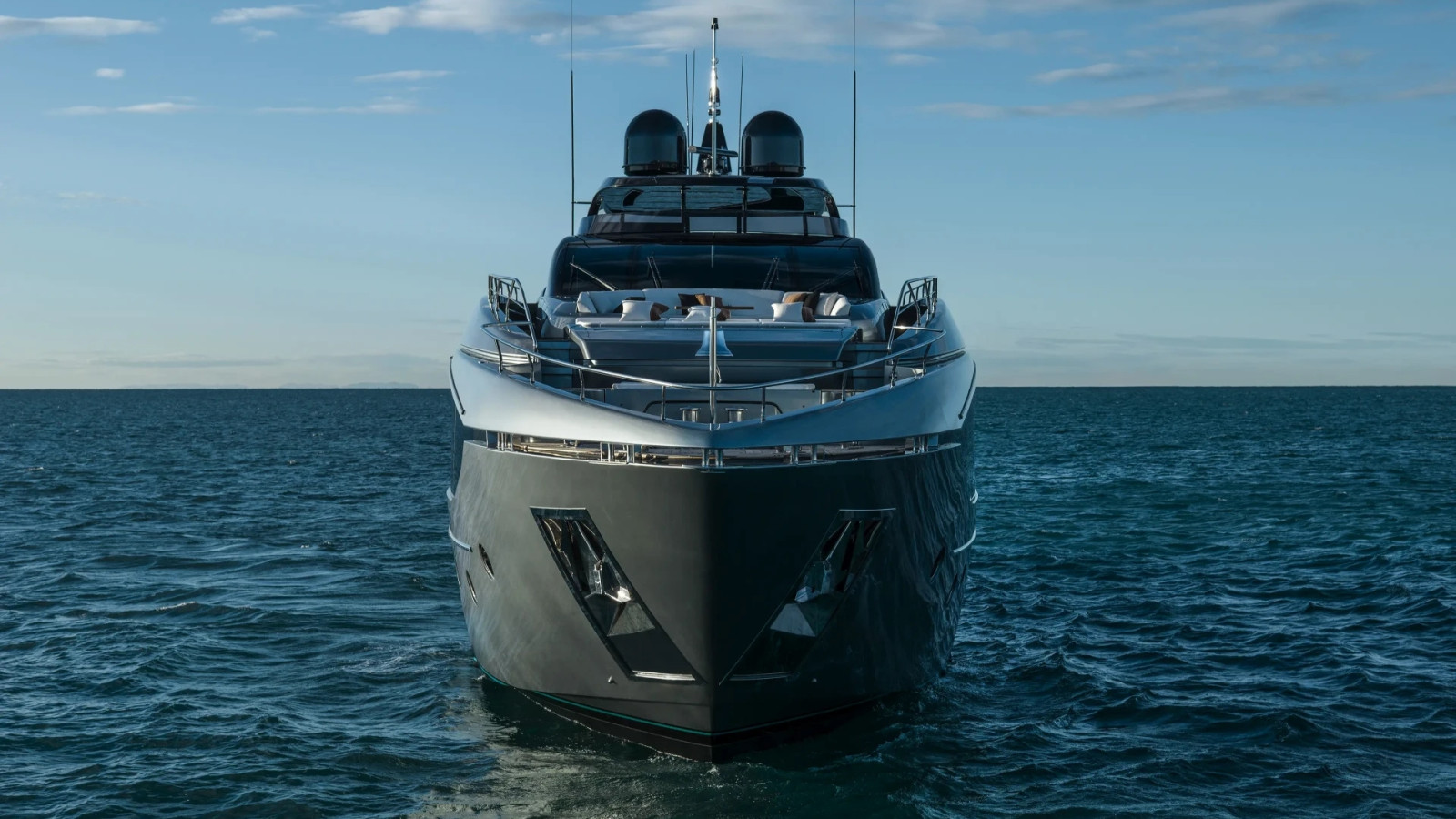 Riva 112' Dolcevita Super viewed from the bow, highlighting its sculpted hull and expanded exterior volumes.