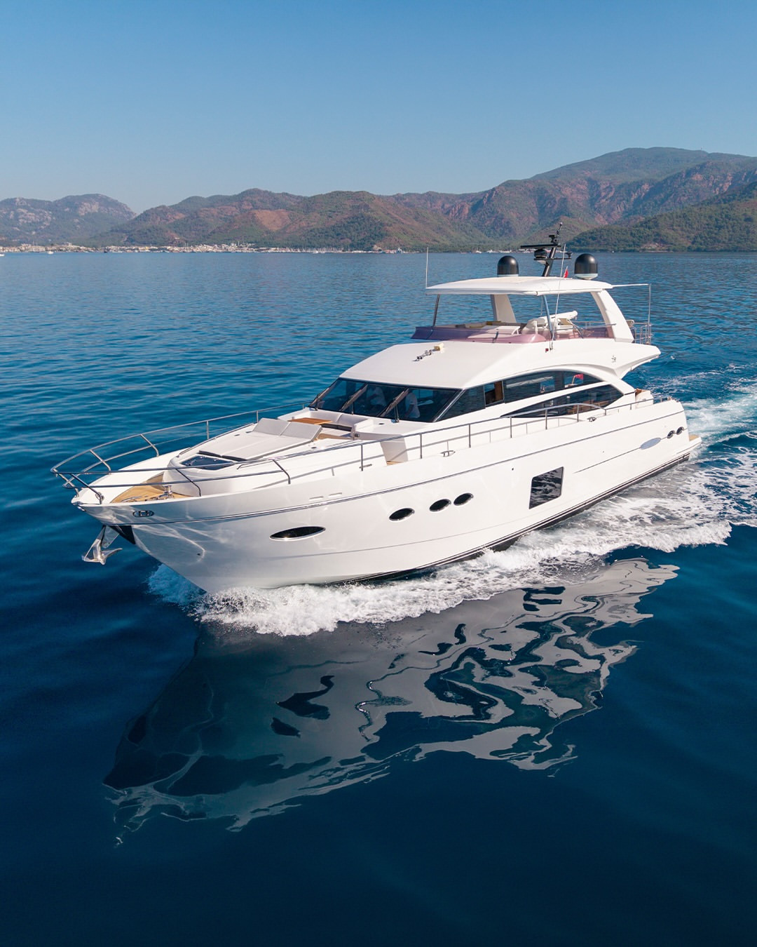 Princess 72 motor yacht (2015) underway at sea, showcasing its elegant exterior profile, flybridge and distinctive Princess design.