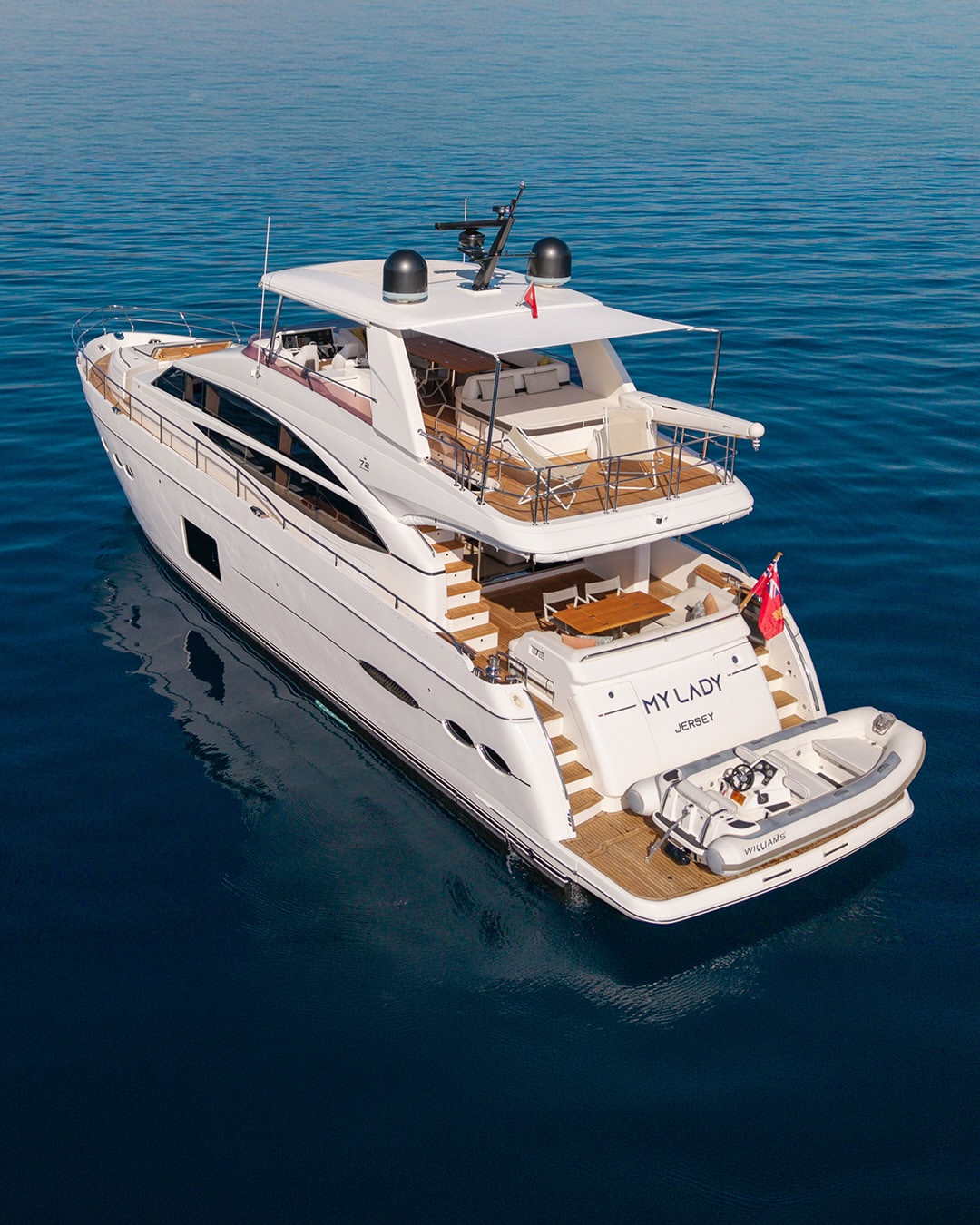 Aft view of the Princess 72 motor yacht (2015), highlighting its flybridge, cockpit, swim platform and tender.