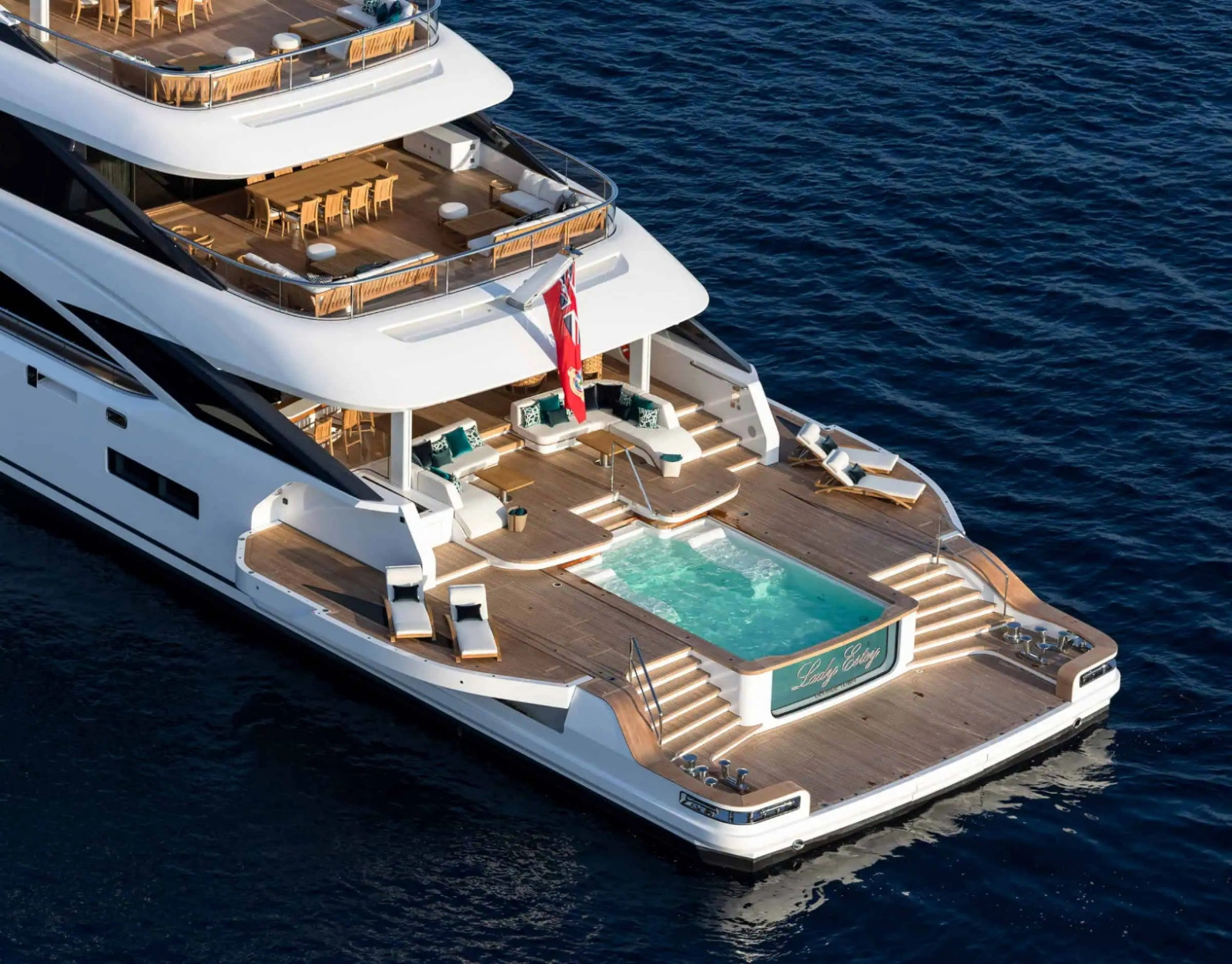 Aerial stern view of the Benetti B.Now 67M highlighting the Oasis Deck®, large pool and generous outdoor entertaining spaces.