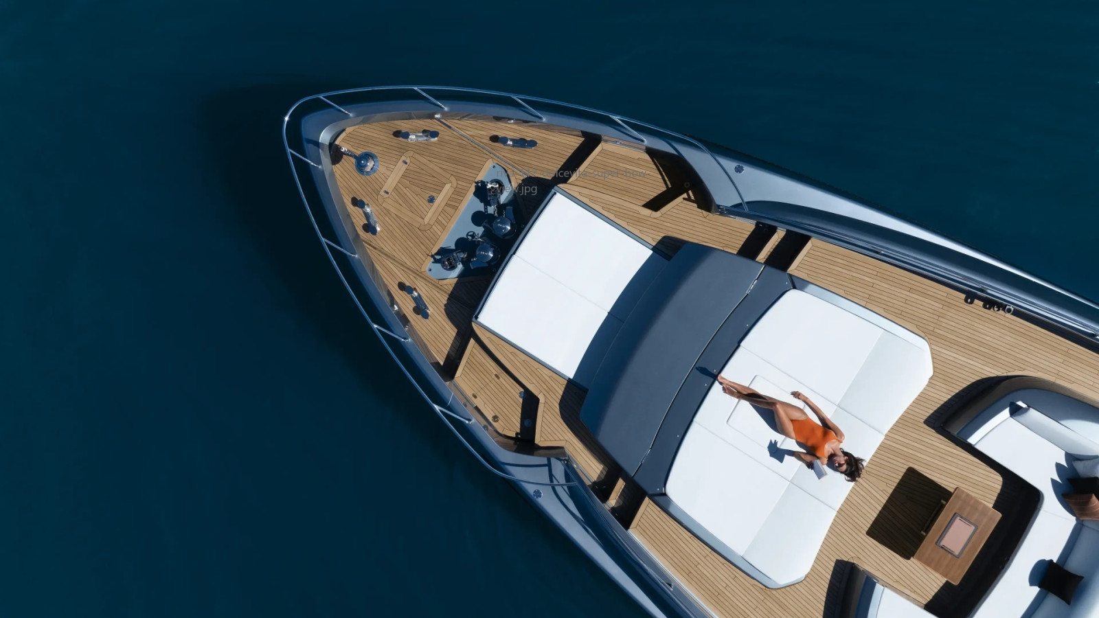 Riva 112' Dolcevita Super foredeck with a spacious sunbathing area designed for relaxation and connection with the sea.