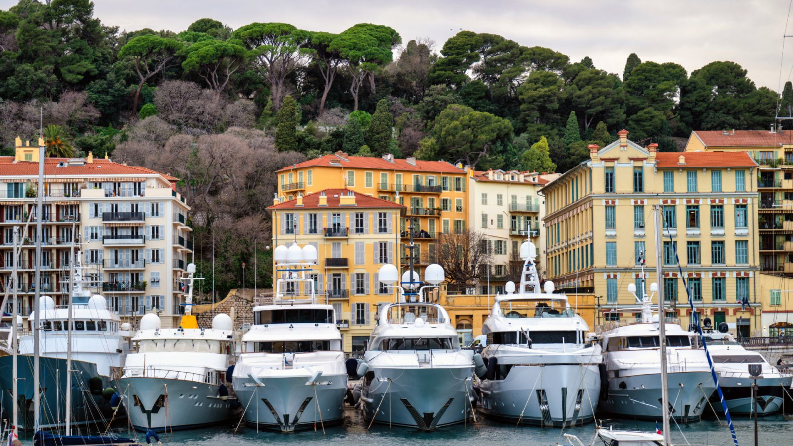 Luxury motor yachts docked at a marina highlighting yacht insurance coverage considerations